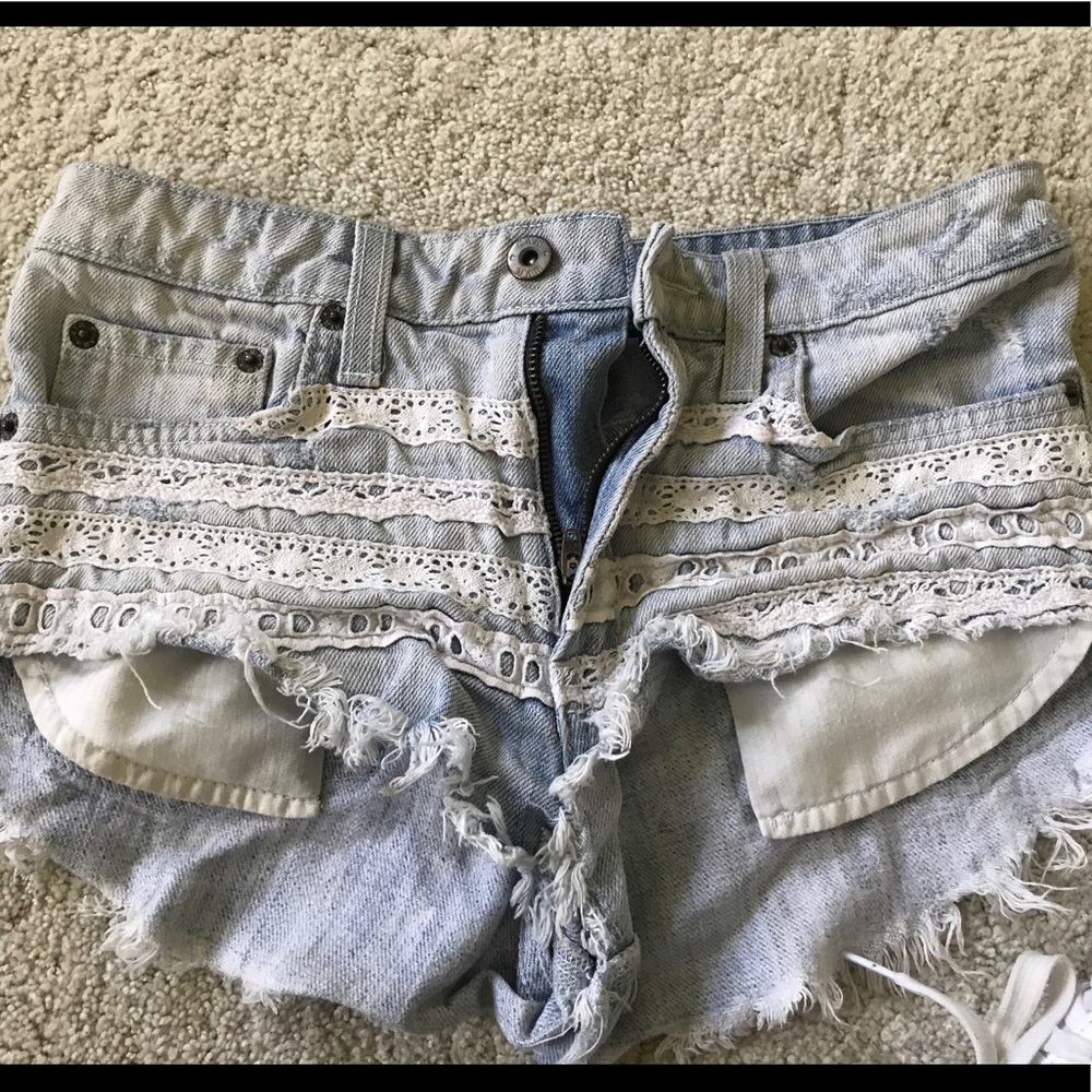 Carmar lace trimmed light wash denim shorts